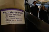 Passengers descend the escalators to the Elizabeth Line platforms at Paddington Station, London, as the new line opens to passengers for the first time.