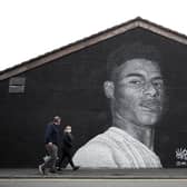 A mural of Manchester United striker Marcus Rashford by Street artist Akse on the wall of the Coffee House Cafe on Copson Street, Withington.