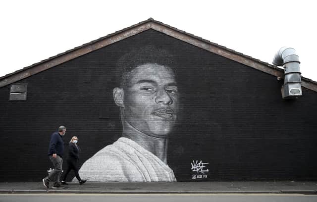 A mural of Manchester United striker Marcus Rashford by Street artist Akse on the wall of the Coffee House Cafe on Copson Street, Withington.