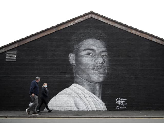 A mural of Manchester United striker Marcus Rashford by Street artist Akse on the wall of the Coffee House Cafe on Copson Street, Withington.