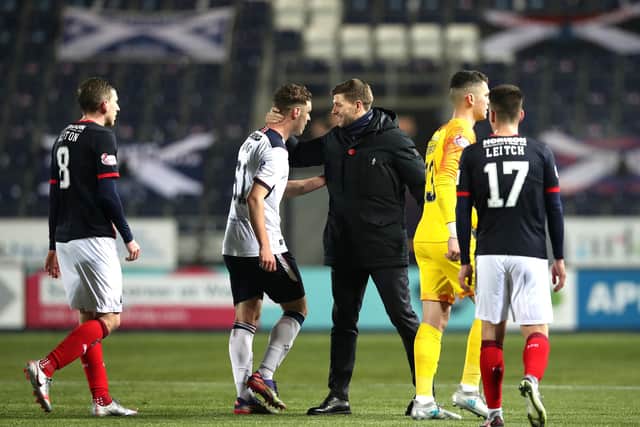 Rangers manager Steven Gerrard congratulates debutant Leon King at the end of the 4-0 Betfred Cup win at Falkirk on Sunday. (Photo by Ian MacNicol/Getty Images)
