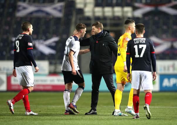 Rangers manager Steven Gerrard congratulates debutant Leon King at the end of the 4-0 Betfred Cup win at Falkirk on Sunday. (Photo by Ian MacNicol/Getty Images)