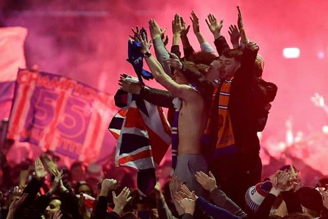 Rangers fans gather in Glasgow's George Square to celebrate the club winning the Scottish Premiership for the first time in ten years on March 7. Picture: Jeff J Mitchell/Getty Images