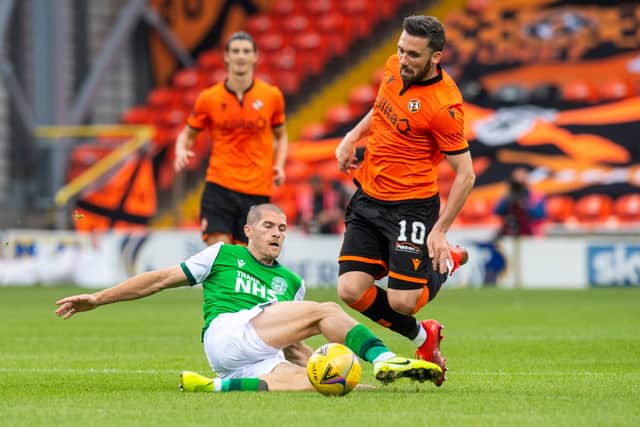 Hibs midfielder Alex Gogic thwarts a Dundee United attack.
