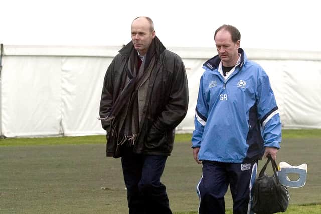Sir Clive Woodward (left) chats to the Lions' head doctor James Robson as he pays a visit to Scotland training in 2005.