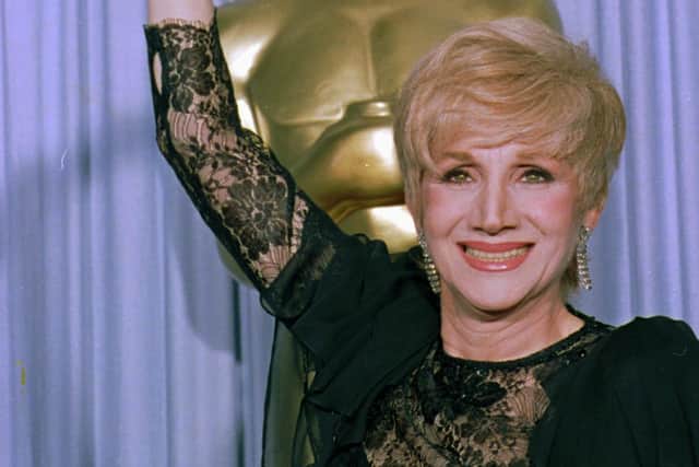 Olympia Dukakis has died aged 89. she can be seen her in 1988 holding her Oscar for best supporting actress for her role in "Moonstrck." (AP Photo/Lennox Mcleondon)