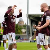 Michael Smith celebrates with his Hearts team-mates after Liam Boyce scored against St Mirren. The Jambos have a 100 per cent record going into the clash with Aberdeen.