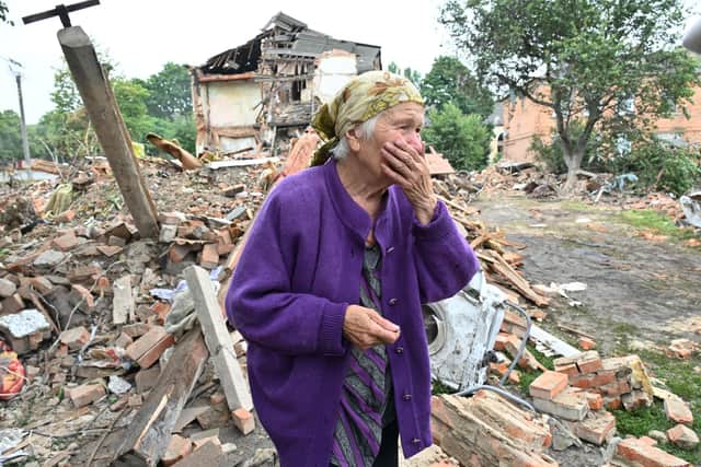 Raisa Kuval, 82, surveys the damage after Russia missiles killed three people in the city of Chuguiv, east of Kharkiv, on July 16 (Picture: Sergey Bobok/AFP via Getty Images)
