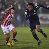 Caleb Chukwuemeka of Aston Villa runs past Ben Usher-Shipway of Stourbridge during the Birmingham Senior Cup match between Stourbridge and Aston Villa U23. (Photo by Nathan Stirk/Getty Images)