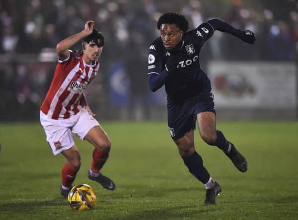 Caleb Chukwuemeka of Aston Villa runs past Ben Usher-Shipway of Stourbridge during the Birmingham Senior Cup match between Stourbridge and Aston Villa U23. (Photo by Nathan Stirk/Getty Images)