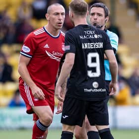 Aberdeen's Scott Brown remonstrates with Livingston's Bruce Anderson.