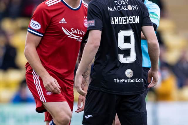 Aberdeen's Scott Brown remonstrates with Livingston's Bruce Anderson.
