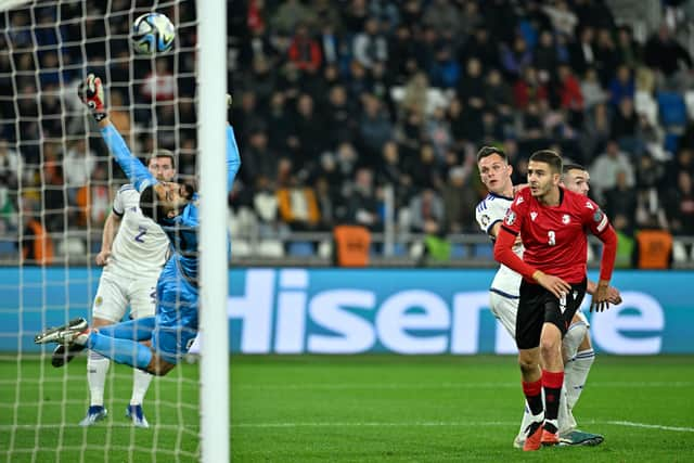 Scotland substitute Lawrence Shankland watches his header nestle past Georgia goalkeeper Giorgi Mamardashvili to secure a 2-2 draw in Tiblisi. (Photo by Levan Verdzeuli/Getty Images)