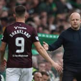 Manager Steven Naismith greets Lawrence Shankland after taking the skipper off in Hearts' 2-0 defeat to Celtic   (Photo by Ross MacDonald / SNS Group)