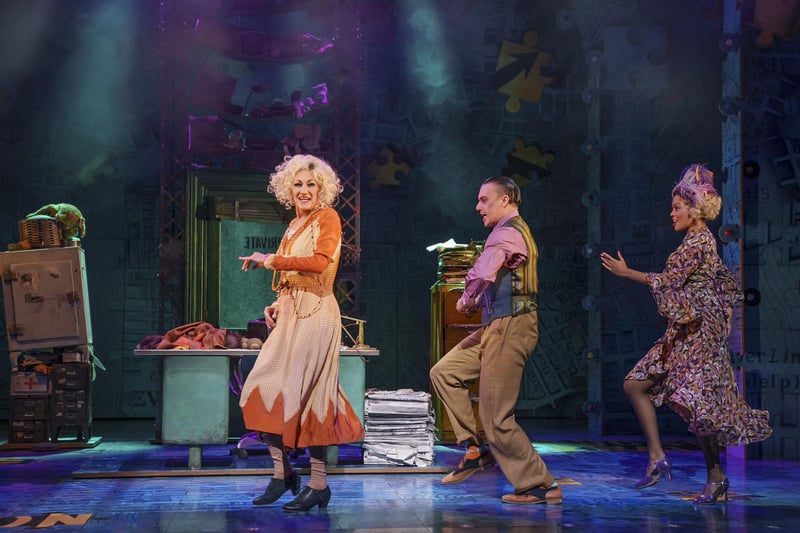 Paul O'Grady in Annie, his last role before his death. This picture shows him on stage at the Playhouse