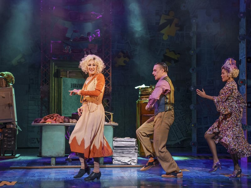 Paul O'Grady in Annie, his last role before his death. This picture shows him on stage at the Playhouse