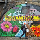 A mural painted in Glasgow near where the COP26 climate summit was held spoke of the urgency for real action. Picture: Jeff J Mitchell/Getty Images