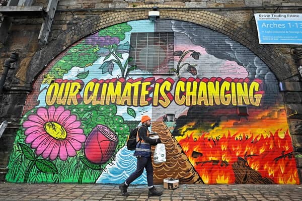 A mural painted in Glasgow near where the COP26 climate summit was held spoke of the urgency for real action. Picture: Jeff J Mitchell/Getty Images