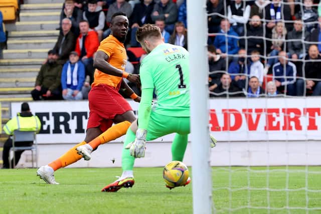 Galatasaray's Mbaye Diagne (left) scores their side's first goal of the game during the UEFA Europa Conference League third qualifying round, second leg match at McDiarmid Park, Perth. Picture date: Thursday August 12, 2021. PA Photo. See PA story SOCCER St Johnstone. Photo credit should read: Steve Welsh/PA Wire.

RESTRICTIONS: Use subject to restrictions. Editorial use only, no commercial use without prior consent from rights holder.