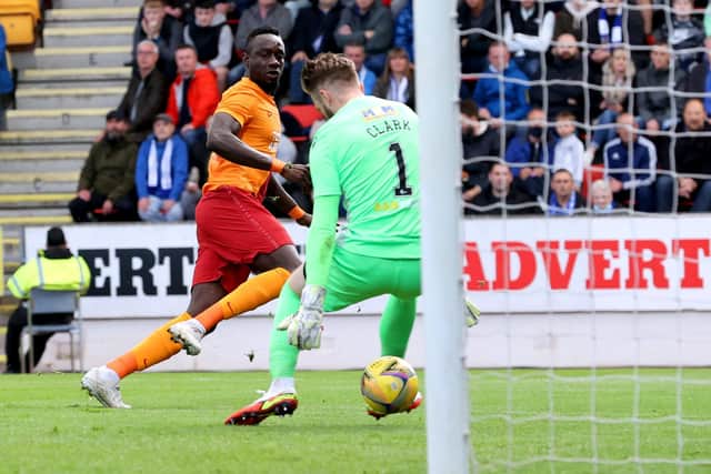 Galatasaray's Mbaye Diagne (left) scores their side's first goal of the game during the UEFA Europa Conference League third qualifying round, second leg match at McDiarmid Park, Perth. Picture date: Thursday August 12, 2021. PA Photo. See PA story SOCCER St Johnstone. Photo credit should read: Steve Welsh/PA Wire.
RESTRICTIONS: Use subject to restrictions. Editorial use only, no commercial use without prior consent from rights holder.