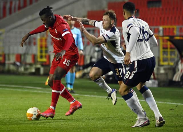 Antwerp's Frank Boya and Rangers' Scott Arfield fight for the ball during a soccer game between Belgian club Royal Antwerp FC and Scottish Rangers F.C., Thursday 18 February 2021 in Antwerp, the first leg of the 1/16 finals of the UEFA Europa League competition. BELGA PHOTO DIRK WAEM (Photo by DIRK WAEM/BELGA MAG/AFP via Getty Images)