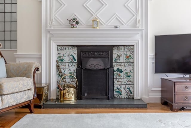 Drawing room fireplace with decorative timber over mantels and original Chinese tiled surrounds.