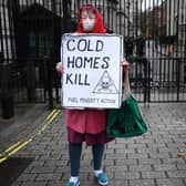 A protestor makes a point about fuel poverty outside Downing Street (Picture: Daniel Leal/AFP via Getty Images)