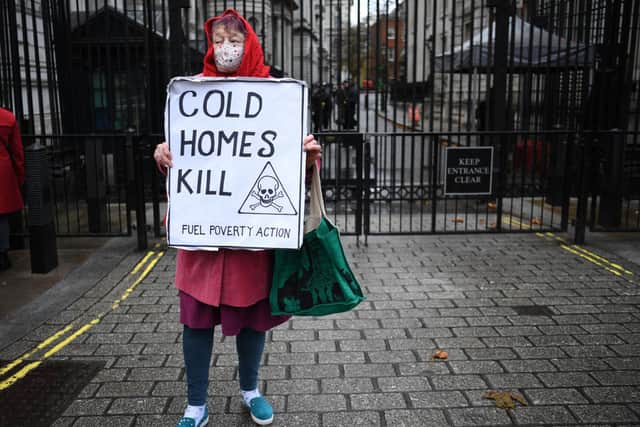 A protestor makes a point about fuel poverty outside Downing Street (Picture: Daniel Leal/AFP via Getty Images)