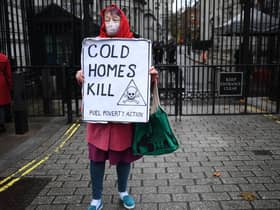 A protestor makes a point about fuel poverty outside Downing Street (Picture: Daniel Leal/AFP via Getty Images)