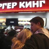 Russian customers wait in line on the opening day of Russia's first Burger King fast food restaurant in Moscow in 2010.