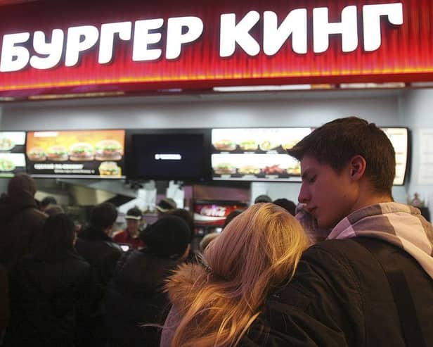 Russian customers wait in line on the opening day of Russia's first Burger King fast food restaurant in Moscow in 2010.