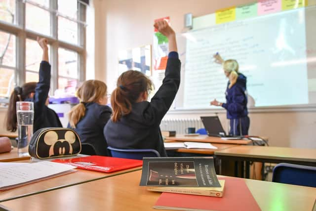 A teacher and students in a classroom. Picture: Ben Birchall/PA Wire