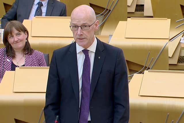 John Swinney delivers the statement on Tuesday