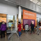Shoppers queue outside a Sainsbury's supermarket during the early stages of last spring's lockdown. Picture: Dan Mullan/Getty Images