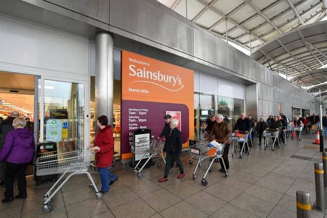 Shoppers queue outside a Sainsbury's supermarket during the early stages of last spring's lockdown. Picture: Dan Mullan/Getty Images