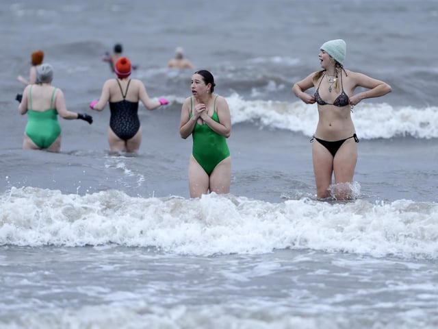 Swimmers take part in a sunrise dip at Portobello Beach, to mark International Women’s Day. Photo by Jeff J Mitchell/Getty Images