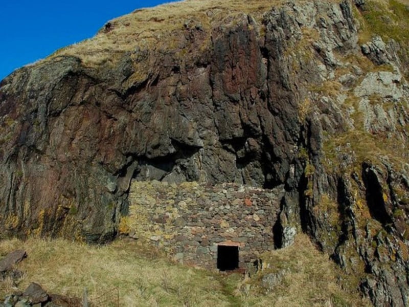 Snib’s Cave is located north of Ballantrae, near Bennane Head. It was famously the home of Henry Ewing Torbet or “Snib Scott” who was reputedly a well-to-do banker in Dundee who went on to give up his charmed lifestyle to spend the remainder of his life as a hermit. Despite being a very private (and proud) man who embraced solitude and self-sufficiency as he hunted for his meals, the local people were apparently fond of him and would often leave gifts of sandwiches and cigarettes nearby his dwelling which he would accept.