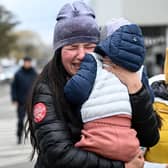 Ukrainian refugees weep after arriving at the Siret border crossing between Romania and Ukraine on Monday (Picture: Daniel Mihailescu/AFP via Getty Images)