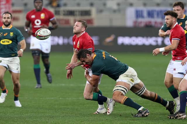 Finn Russell gets the ball away in time before being tackled by Eben Etzebeth. Picture: EJ Langner/Gallo Images/Getty Images
