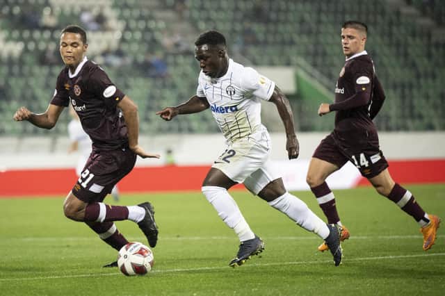 Hearts' Toby Sibbick, left, fights for the ball with Zurich's Wilfried Gnonto, right, during Hearts' match with Zurich.