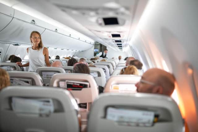 Walking down the aisle on flight helps avoid deep vein thrombosis. Pic: Alamy/PA.