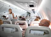 Walking down the aisle on flight helps avoid deep vein thrombosis. Pic: Alamy/PA.