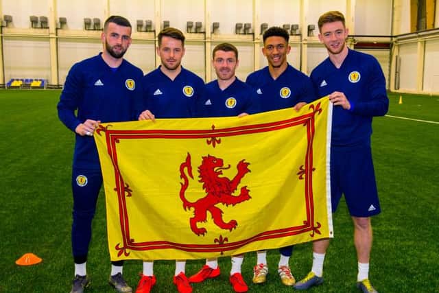 Liam Kelly with Marc McNulty, John Fleck, Liam Palmer and Stuart Findlay after being called up to the senior Scotland squad in March 2019. (Photo by SNS Group).