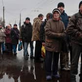 People queue to receive food from AFAT - Disaster and Emergency Management Presidency in the Ukrainian city of Chernihiv, last year. The Chernihiv region found itself on the frontline of Russia's invasion at the beginning of the invasion.