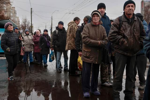 People queue to receive food from AFAT - Disaster and Emergency Management Presidency in the Ukrainian city of Chernihiv, last year. The Chernihiv region found itself on the frontline of Russia's invasion at the beginning of the invasion.