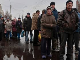 People queue to receive food from AFAT - Disaster and Emergency Management Presidency in the Ukrainian city of Chernihiv, last year. The Chernihiv region found itself on the frontline of Russia's invasion at the beginning of the invasion.