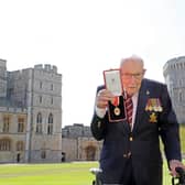 Captain Sir Tom Moore after he received his knighthood from Queen Elizabeth II during a ceremony at Windsor Castle.