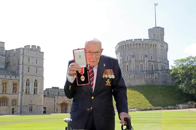 Captain Sir Tom Moore after he received his knighthood from Queen Elizabeth II during a ceremony at Windsor Castle.