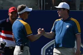 European captain Luke Donald congratulates Bob MacIntyre after his singles win over Wyndham Clark, who is looking on, in the singles in the 2023 Ryder Cup in Rome. Picture: Andreas Solaro/AFP via Getty Images.