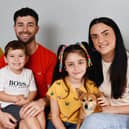 Rudi Bell, four, with dad Ross, mum Sam, sister Rosie, seven, and pet dog Luna. Pic: Michael Gillen